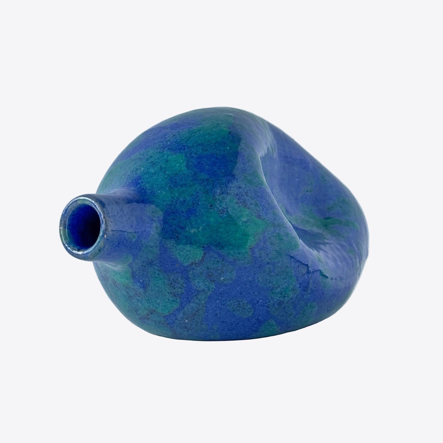 A vibrant blue and green North Carolina pottery pinch bottle vase with pinch sculptural detail.