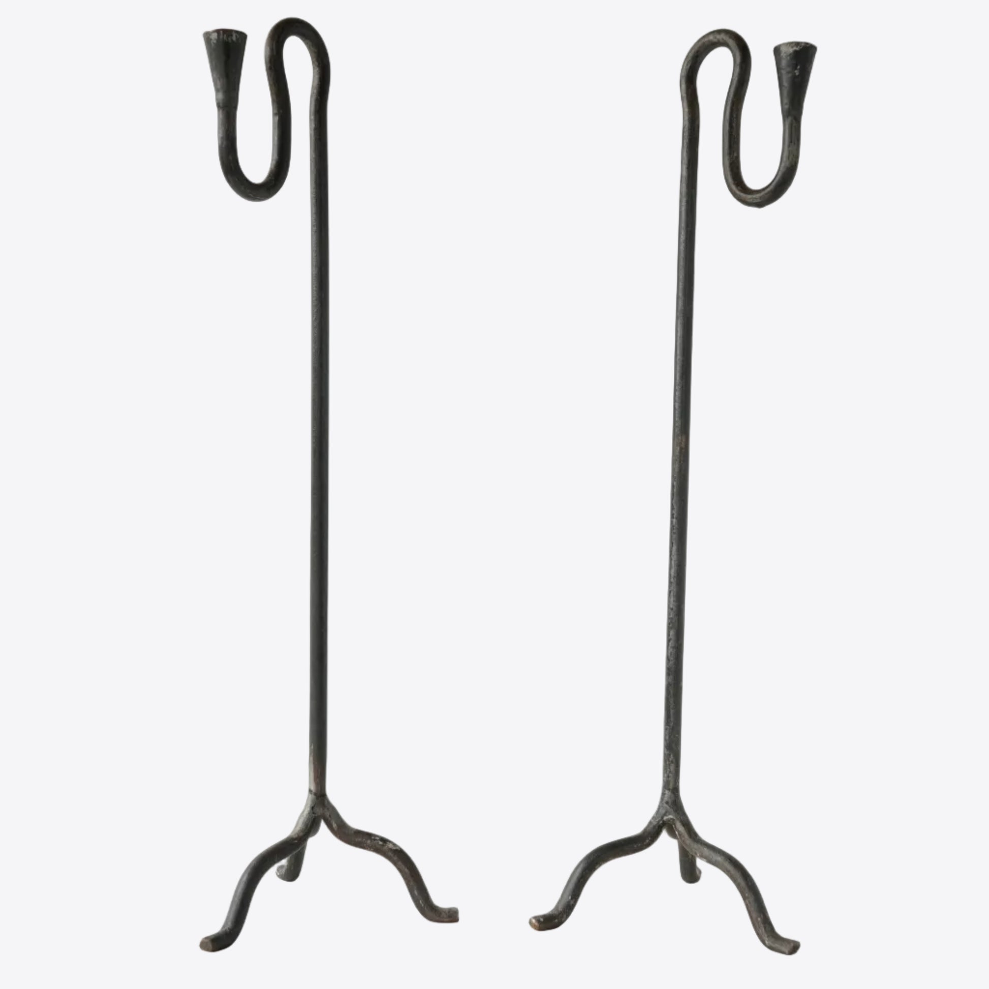 Pair of wrought iron hand-forged candle holders with sculptural squiggle detail. 