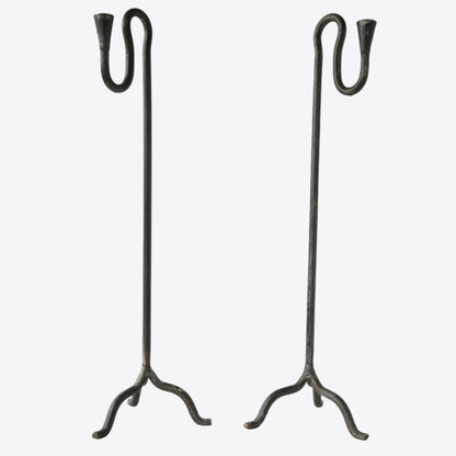 Pair of wrought iron hand-forged candle holders with sculptural squiggle detail. 