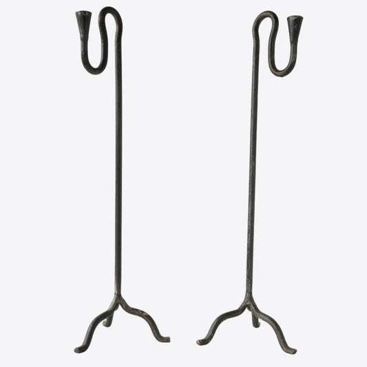 Pair of wrought iron hand-forged candle holders with sculptural squiggle detail. 